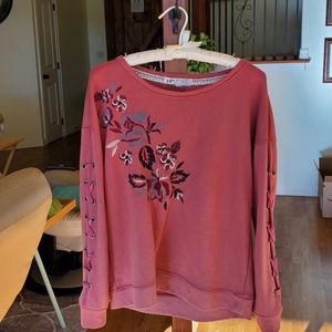 Embroidered sweat shirt with ribbon sleeve detail.